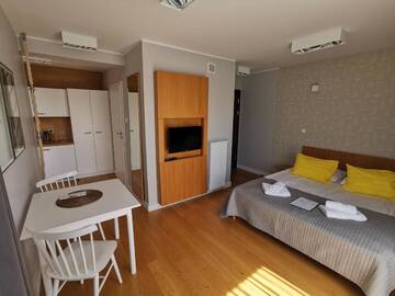 Фото номера Большой двухместный номер с 1 кроватью Апарт-отели Apartamenty Paliki г. Ястшембя-Гура 4