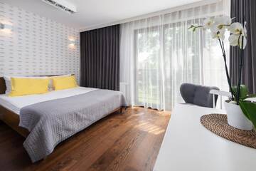 Фото номера Большой двухместный номер с 1 кроватью Апарт-отели Apartamenty Paliki г. Ястшембя-Гура 3