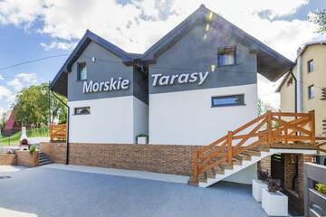 Фото номера Двухуровневые апартаменты Лоджи Domki Morskie Tarasy г. Ястшембя-Гура 33